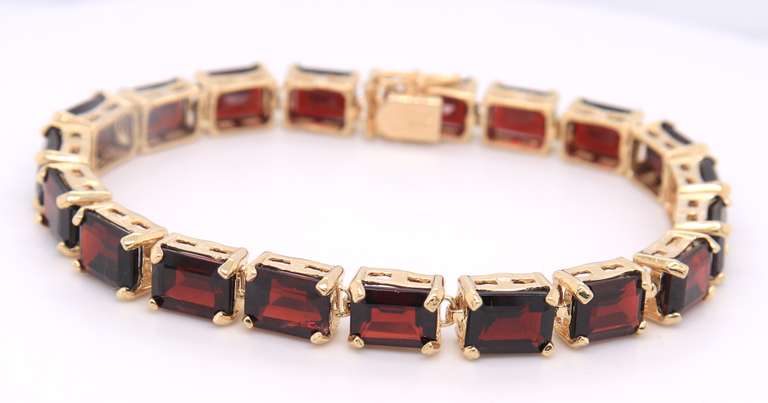 Majestic Yellow Gold Garnet Emerald Cut Bracelet
