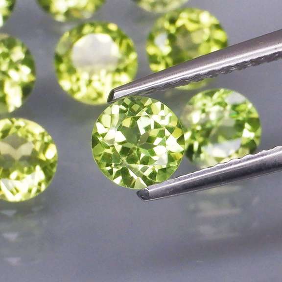 High grade 6.68ct untreated apple green Peridot set