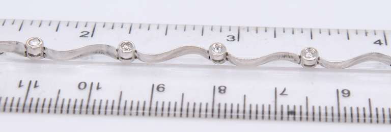 Elegant White Gold Diamond Station Wave Bracelet