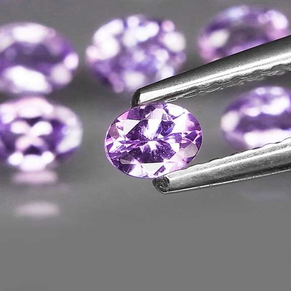 Heavy flashing 4.82ct oval cut Tanzanite set