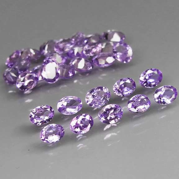 Heavy flashing 4.82ct oval cut Tanzanite set