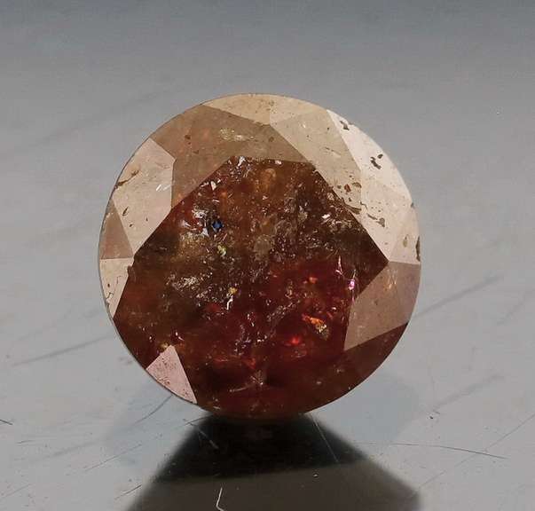 Eye catching 1.25ct round cut earth tones Diamond solitaire