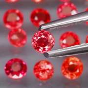 Round cut 3.39ct Imperial Red Sapphire set