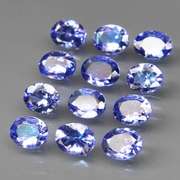 Heavy flashing 4.10ct oval cut Tanzanite set