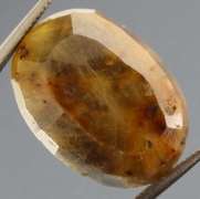 Super unique calico 13.44ct faceted Sapphire