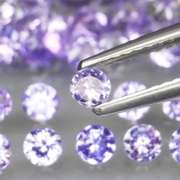 Heavy flashing 4.81ct diamond cut Tanzanite set