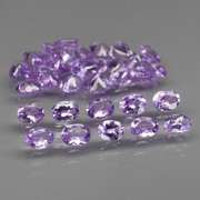 Heavy flashing 5.47ct oval cut Tanzanite set