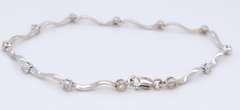 Elegant White Gold Diamond Station Wave Bracelet