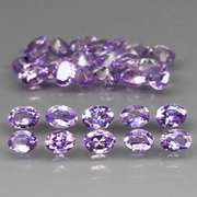 Heavy flashing 4.82ct oval cut Tanzanite set