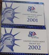 2 sets:  2001 & 2002 PRF Sets   NOTE: The US Mint is now charging $32 for current non-Silver PROOF Sets.