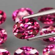 Remarkable 13.19ct violet pink Rhodolite Garnet set