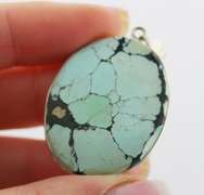 Striking well marbled 52.84ct Turquoise cabochon sterling pendant