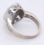 Powerful 18kt oval Sapphire and Diamond Halo Ring