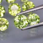 High grade 6.68ct untreated apple green Peridot set