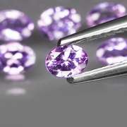 Heavy flashing 4.82ct oval cut Tanzanite set