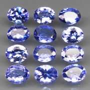Heavy flashing 4.10ct oval cut Tanzanite set