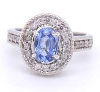 Powerful 18kt oval Sapphire and Diamond Halo Ring