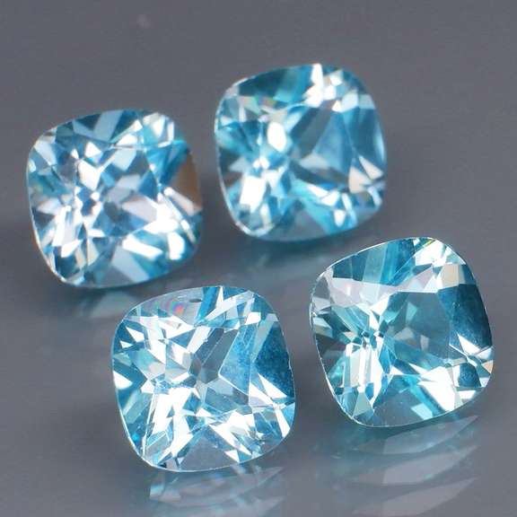 Large 10.06ct vivid blue cushion cut Topaz set