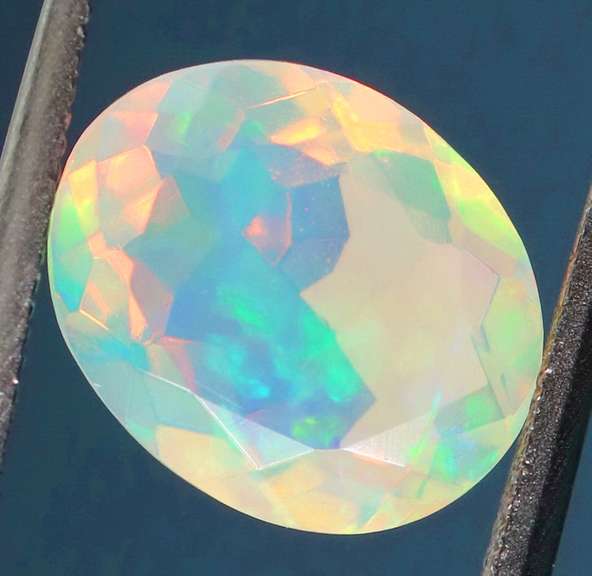 Excellent glittering 1.69ct faceted Jelly Opal