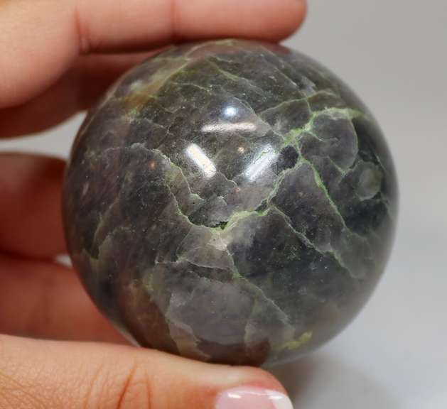 Substantial 1,471ct sphere cut galaxy patterned Iolite