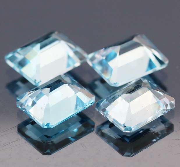Large 14.89ct vivid blue emerald cut Topaz set