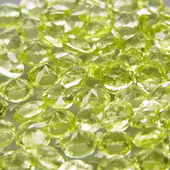 High grade 4.85ct untreated apple green Peridot set