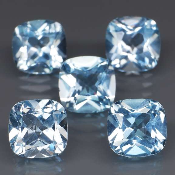 Large 12.57ct vivid blue cushion cut Topaz set