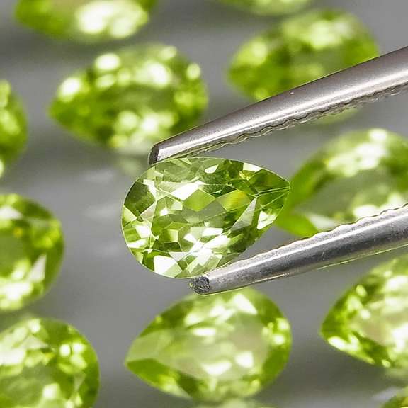 Fantastic 8.87ct 6x4mm pear cut Peridot set