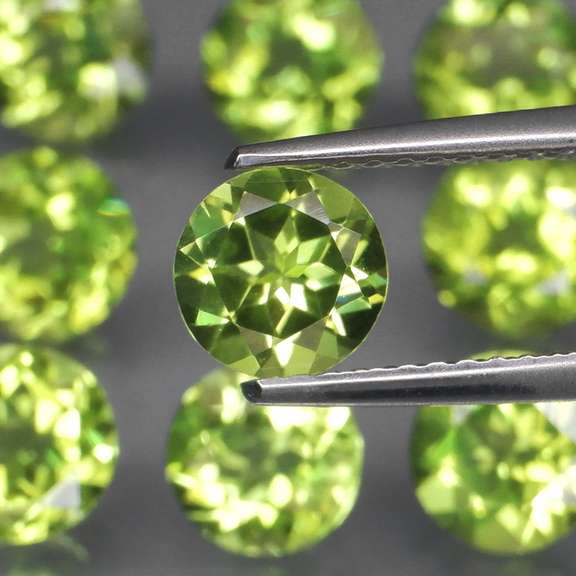 High grade 8.40ct untreated apple green Peridot set