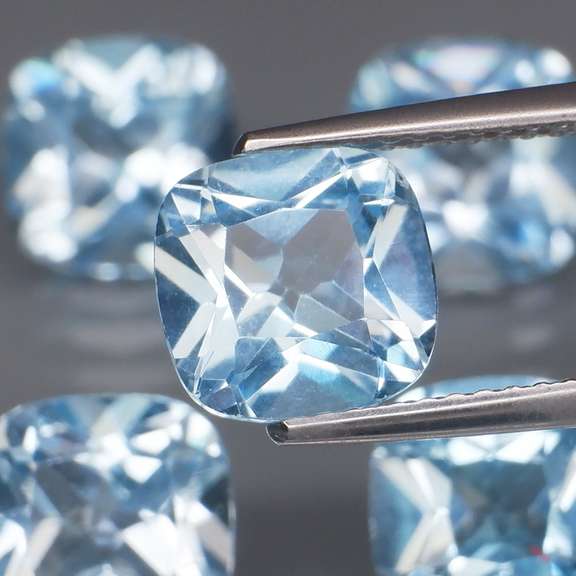 Large 12.25ct vivid blue cushion cut Topaz set