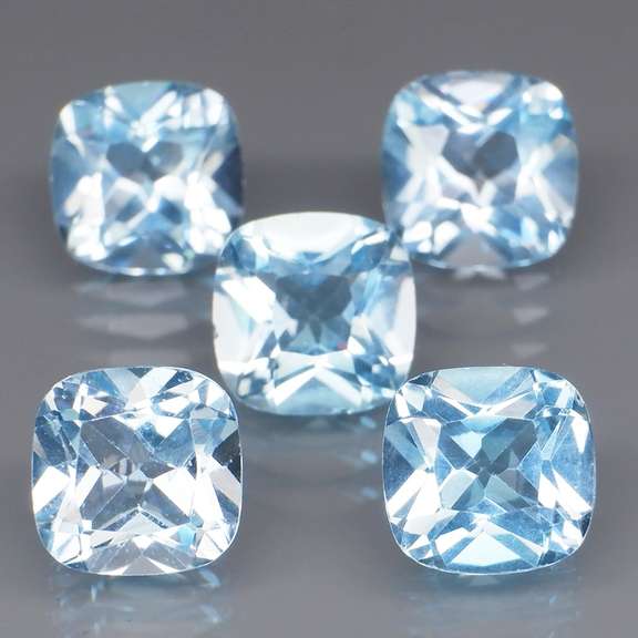 Large 12.25ct vivid blue cushion cut Topaz set
