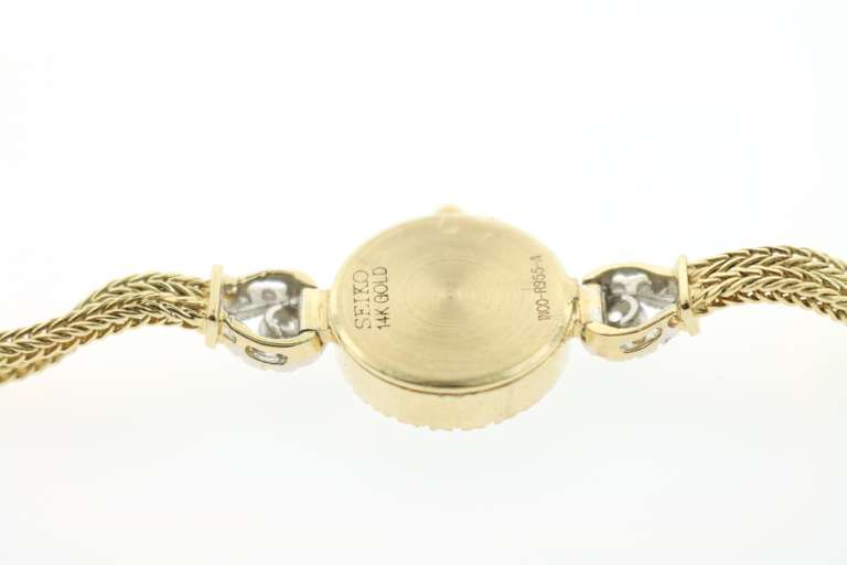 LADIES 14K GOLD AND DIAMOND SEIKO WATCH