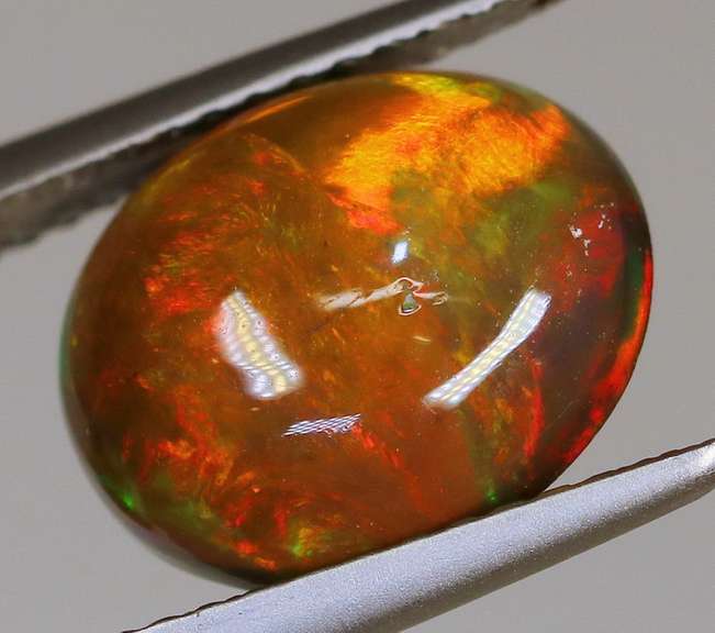 Magnificent 2.05ct full body flashing Black Opal