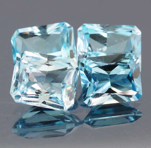 Matched! 4 piece 20.13ct full fire Swiss blue Topaz set