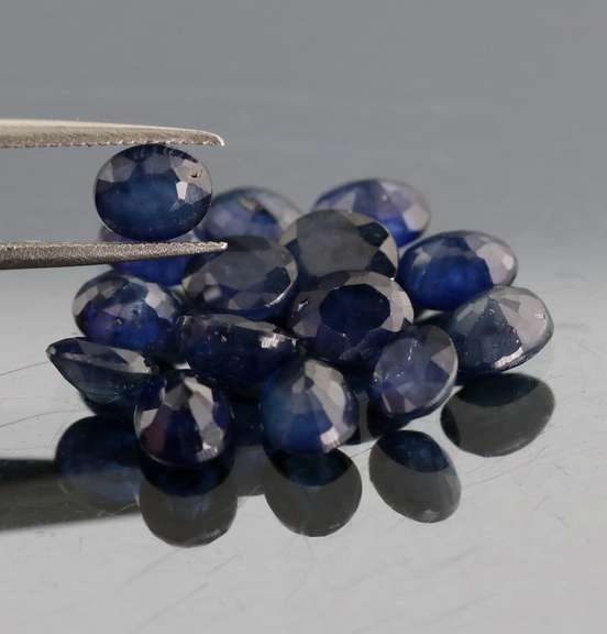 Captivating ink blue 7.80ct oval Sapphire set