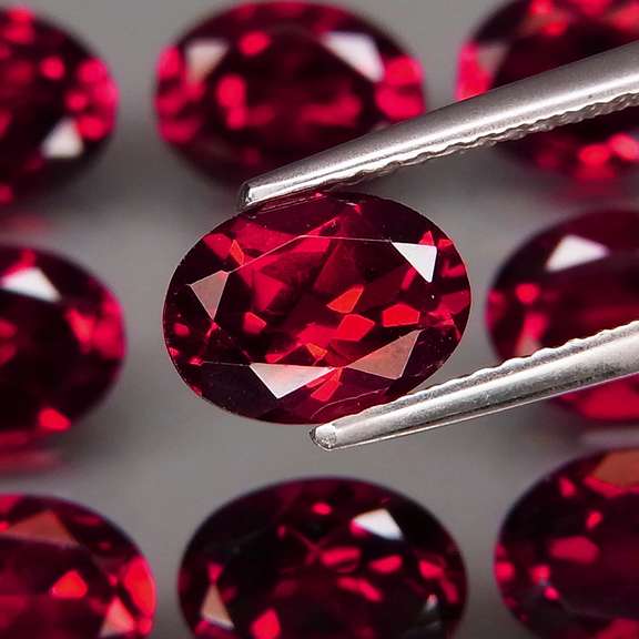 Premium 13.13ct oval cut cherry red Garnet set