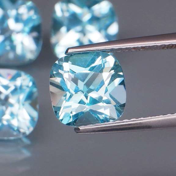 Large 10.06ct vivid blue cushion cut Topaz set