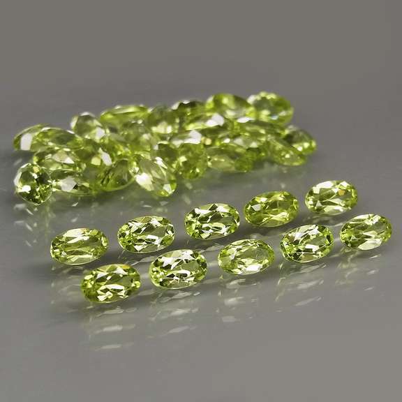 Dazzling 8.75ct untreated lime green Peridot set