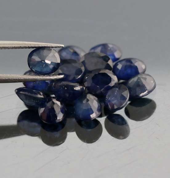 Captivating ink blue 7.80ct oval Sapphire set