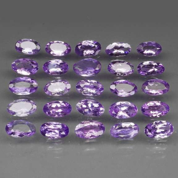 Heavy flashing 5.05ct oval cut Tanzanite set