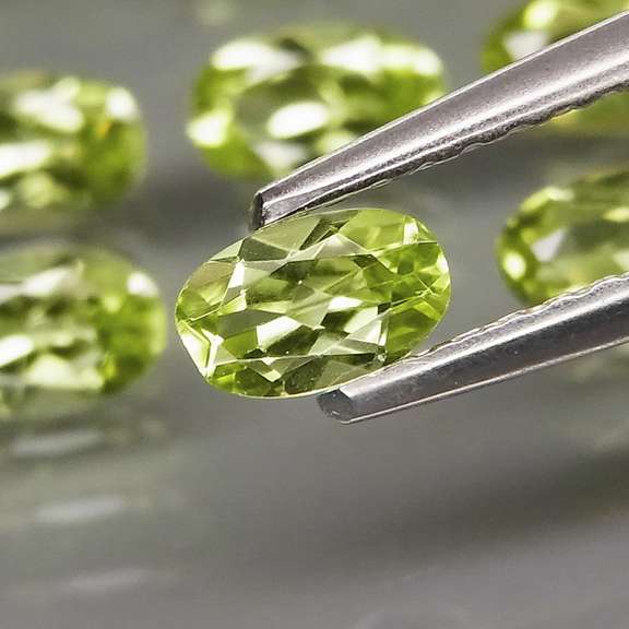 Dazzling 8.75ct untreated lime green Peridot set