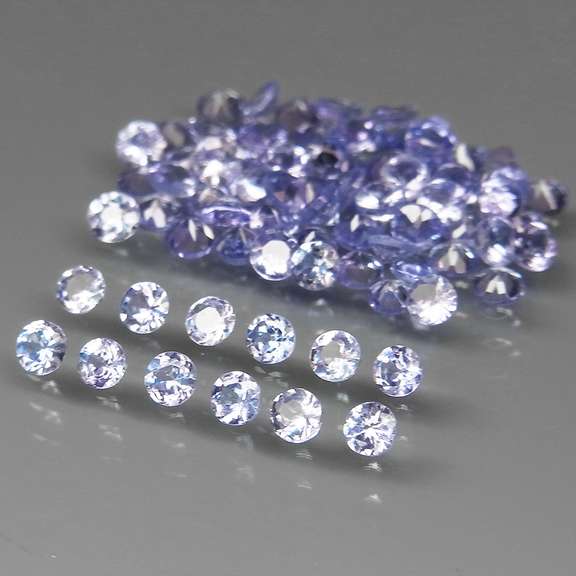 Heavy flashing 6.30ct diamond cut Tanzanite set
