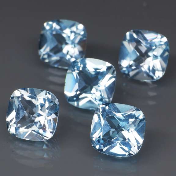 Large 12.57ct vivid blue cushion cut Topaz set
