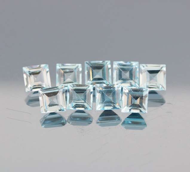 Amazing 12.46ct radiant cut ice blue Topaz set