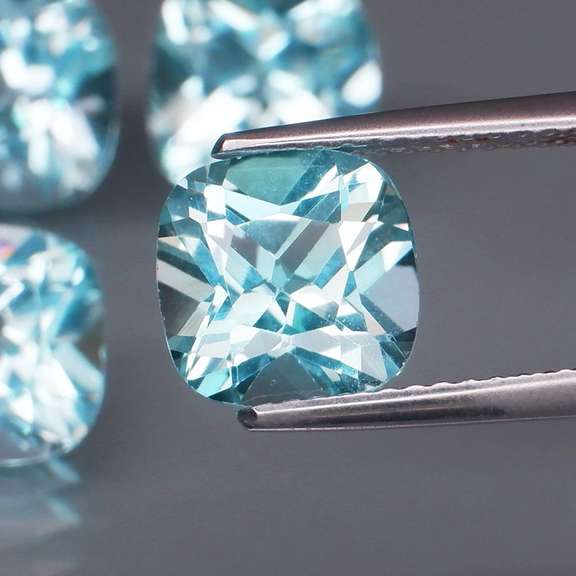 Large 10.08ct vivid blue cushion cut Topaz set