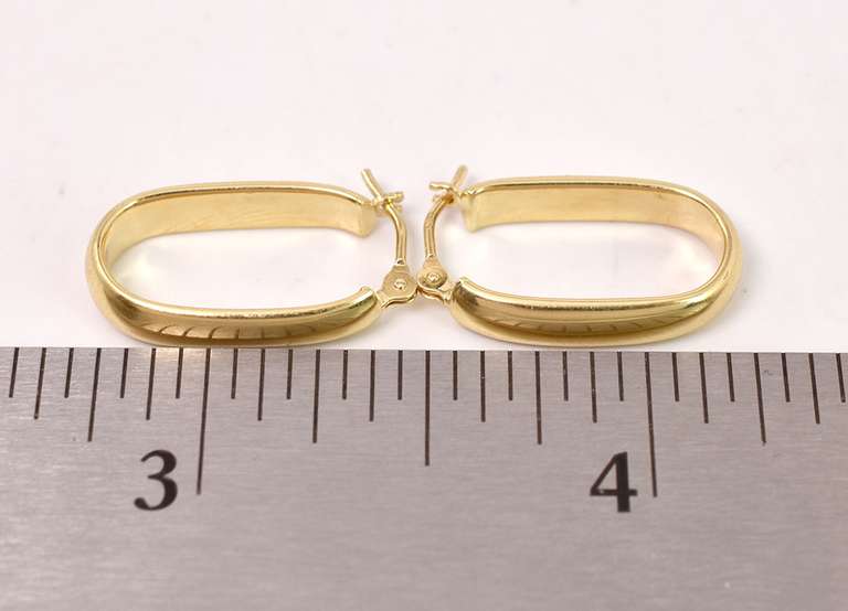 Delightful Oval Hoop Earrings in 18K Yellow Gold