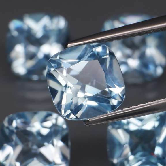 Large 12.57ct vivid blue cushion cut Topaz set