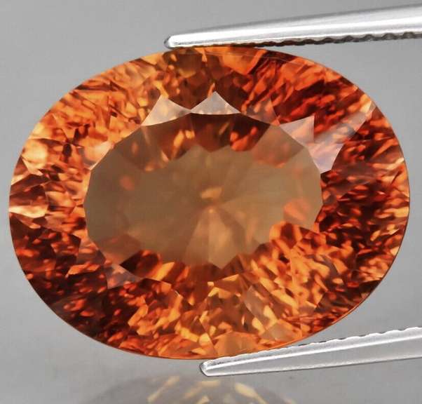Fiery flashing 16.17ct amber Imperial Topaz