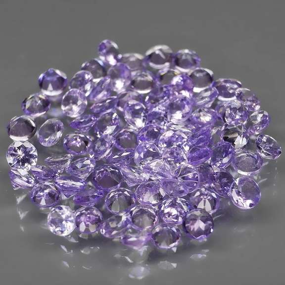 Heavy flashing 5.14ct diamond cut Tanzanite set