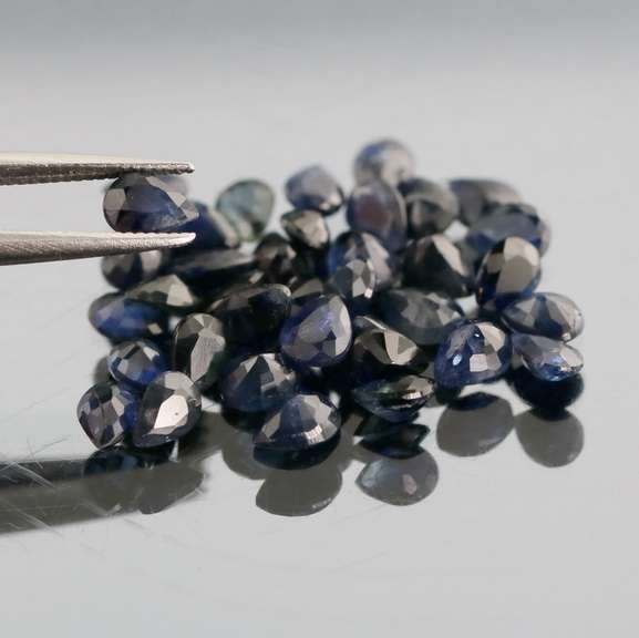 Stunning ink blue 7.14ct pear cut Sapphire set